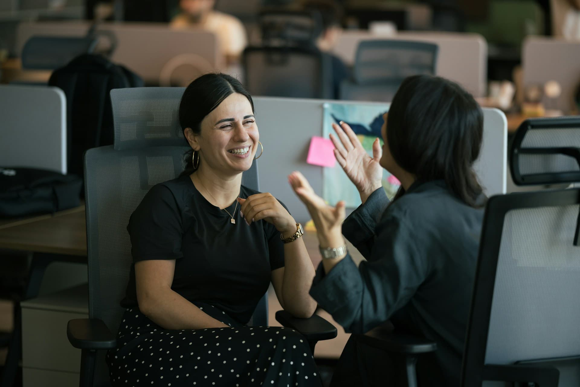 Julia smiling during a talk at the office